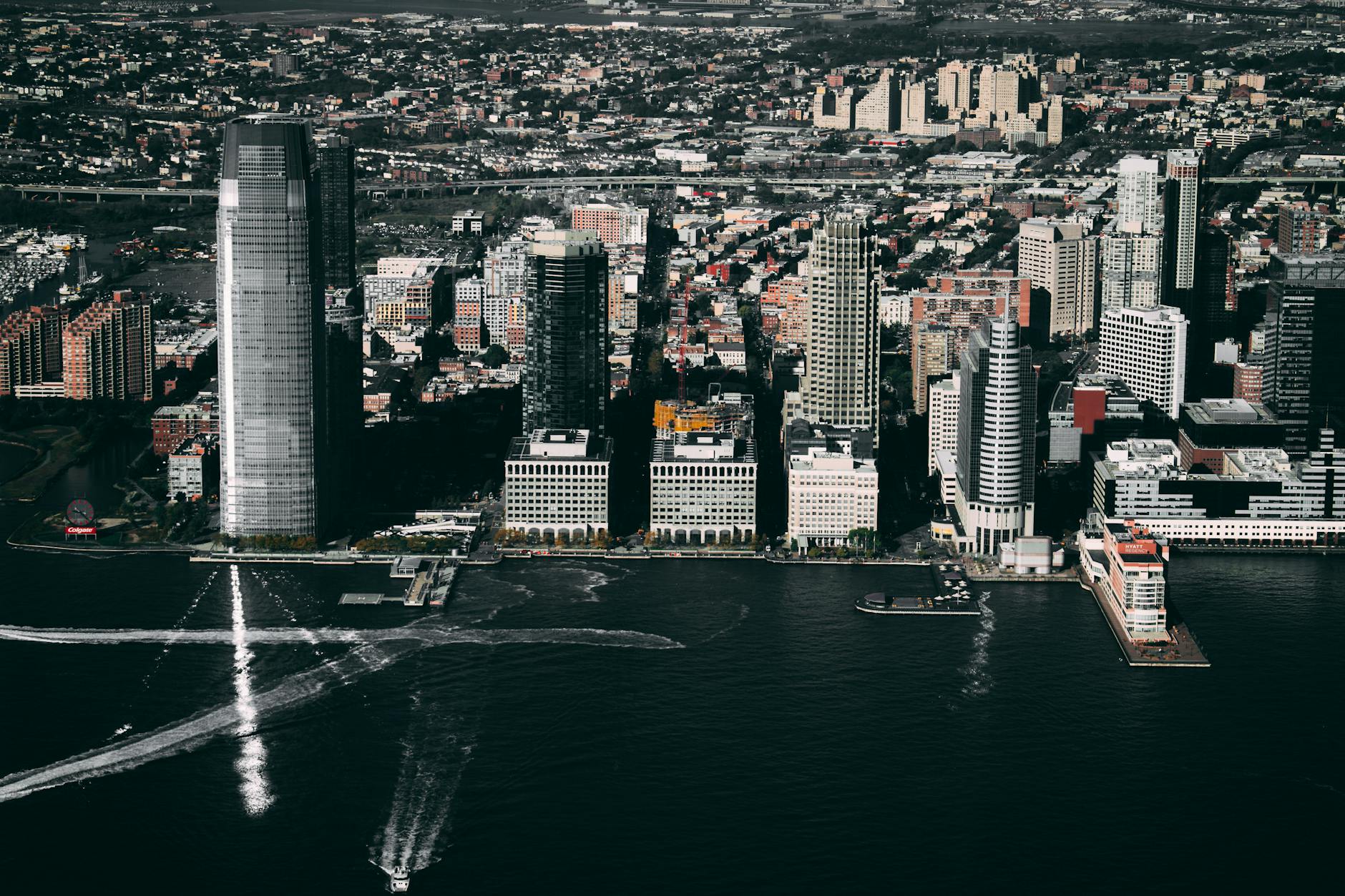 Dramatic aerial view of the Jersey City skyline showcasing prominent skyscrapers along the Hudson River.