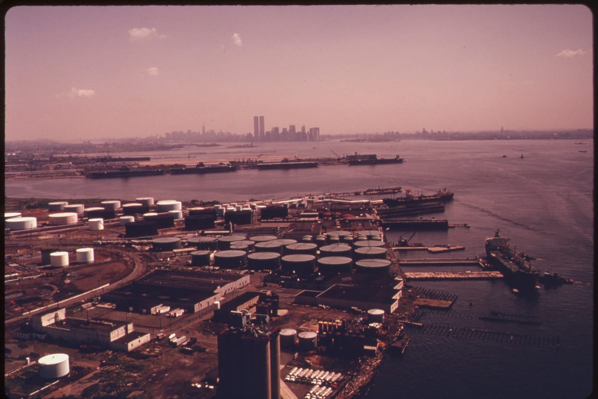 Bayonne, NJ — BAYONNE, NEW JERSEY, ON UPPER NEW YORK BAY WITH THE MANHATTAN SKYLINE IN THE BACKGROUND. LANDS ADJACENT TO THE BIGHT... - NARA - 555724