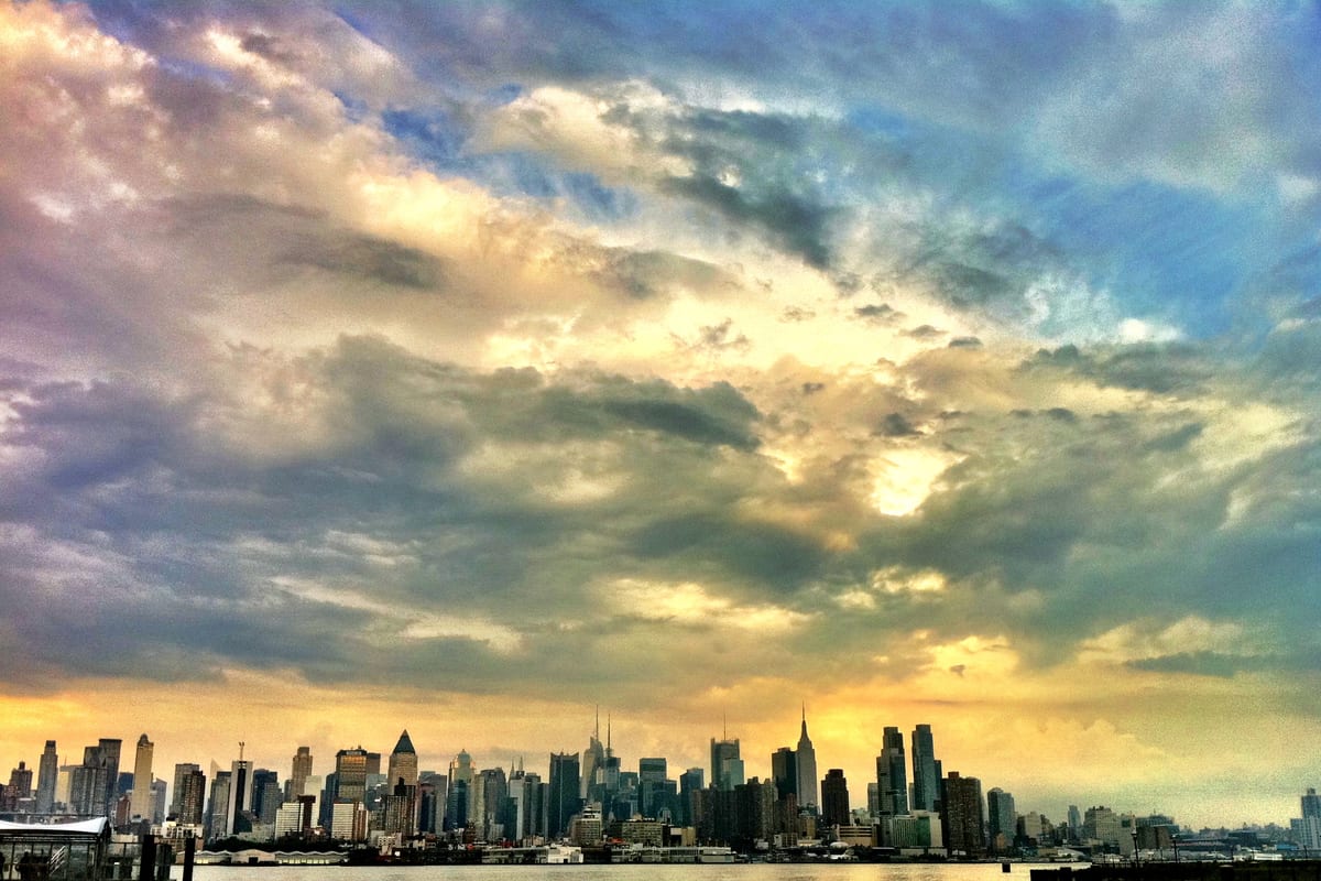 Hackensack, NJ — The New York City skyline after a stormy afternoon from Port Imperial, NY Waterway in Weehawken New Jersey