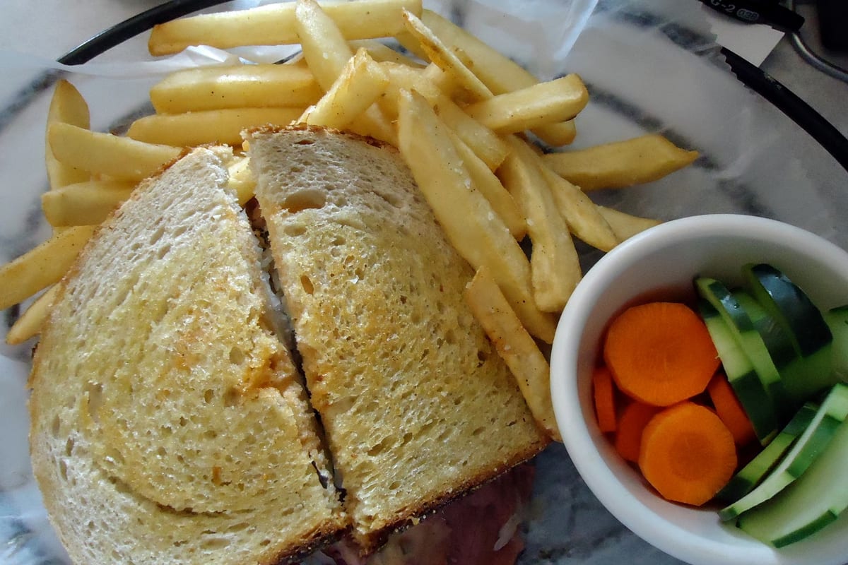 Maplewood, NJ — Pastrami Rubin sandwich with fries and vegetables at the Maplewood Deli & Grille in New Jersey