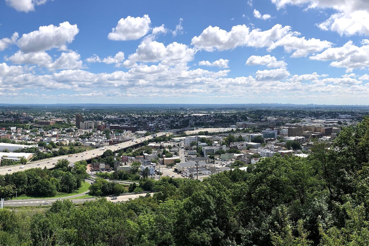 Paterson, NJ — 2024-08-13 11 29 16 Panoramic view north and east towards downtown Paterson and Interstate 80 (Bergen-Passaic Expressway) from the main overlook within the Garret Mountain Reservation in Paterson, Passaic County, New Jersey